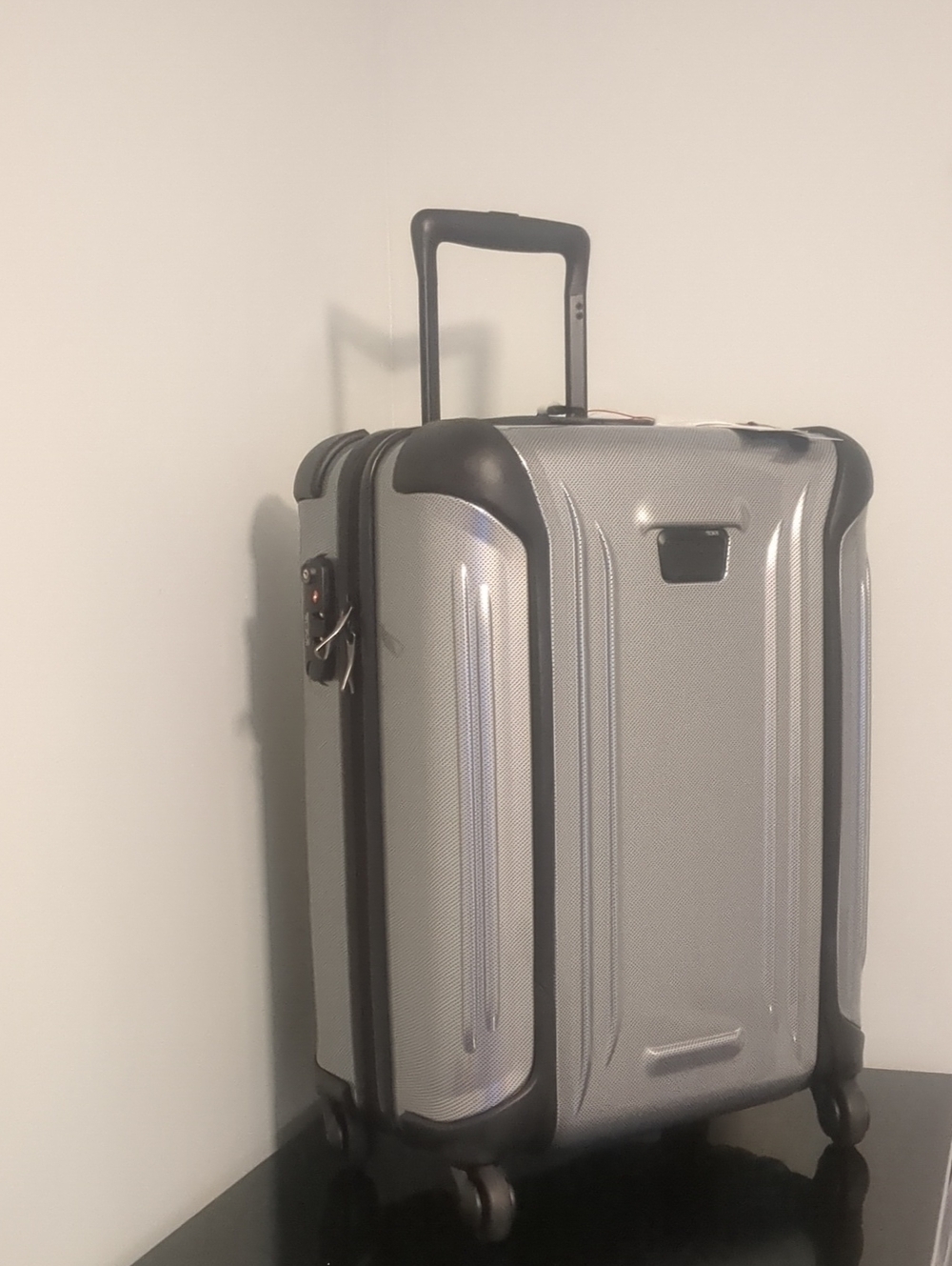 TUMI/ Continental Carry On Silver Hard-Shell Rolling Luggage